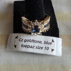 Goldtone Ring with Blue Topaz Accent